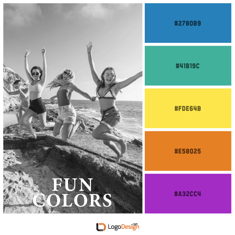 Black and white image of three people joyfully jumping on rocks at the beach.