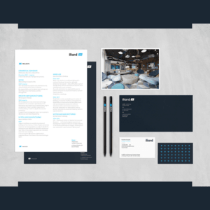 A branded stationery set is displayed, featuring a letterhead, business cards, pens, an envelope, and a pamphlet.