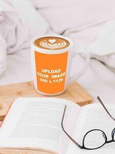 mockup generator coffee cup place next to opened book